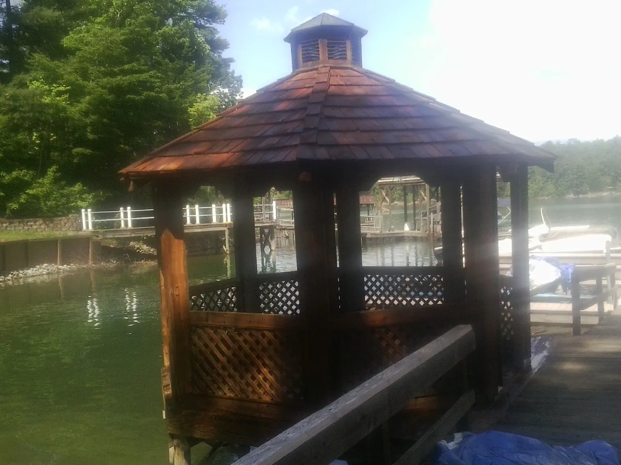 Cedar shake gazebo roof rebuilt on a lake dock in Miles
