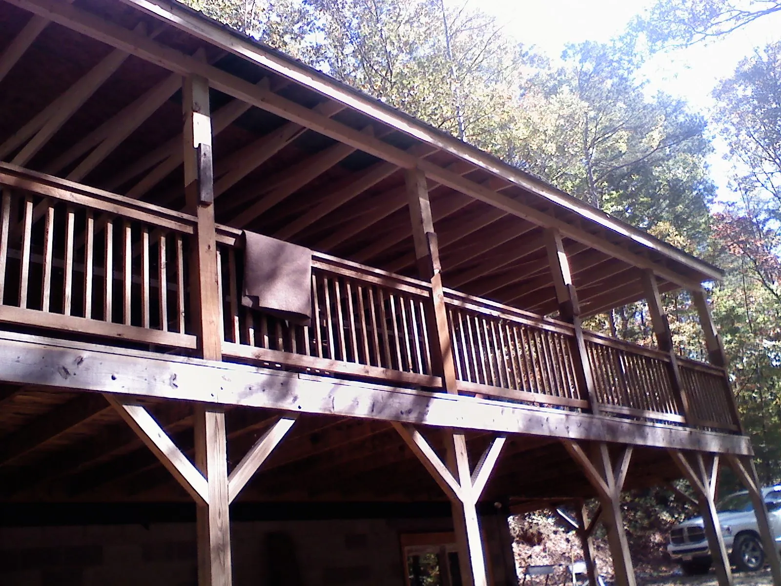 Timber framing under a new elevated porch and deck — Roof Leak Repair in Miles by Roofing Brothers
